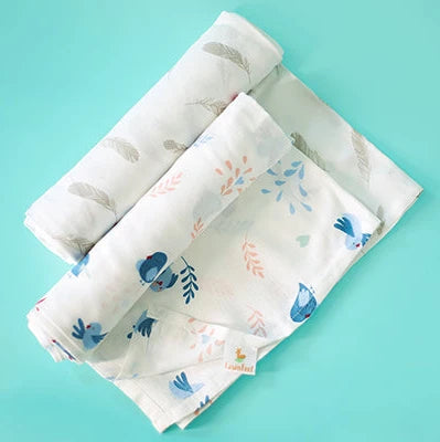 Cuddle up in Chirpy Bird Print And Feather Print Bamboo Swaddle