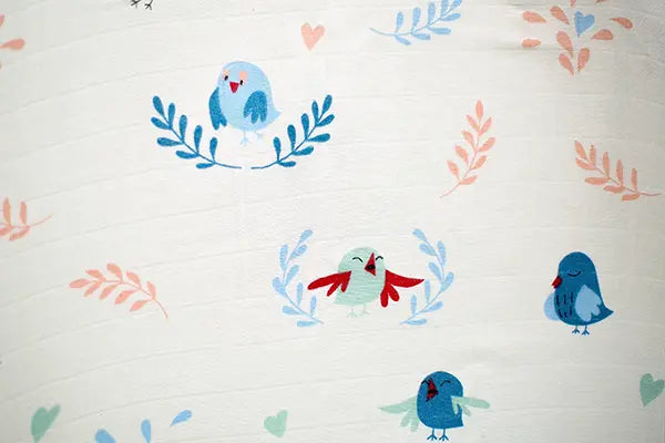 Cuddle up in Chirpy Bird Print Bamboo Swaddle