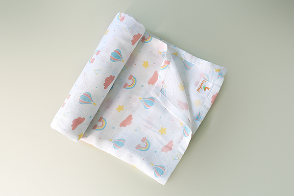 Cuddle up in Rainbow Print Bamboo Swaddle