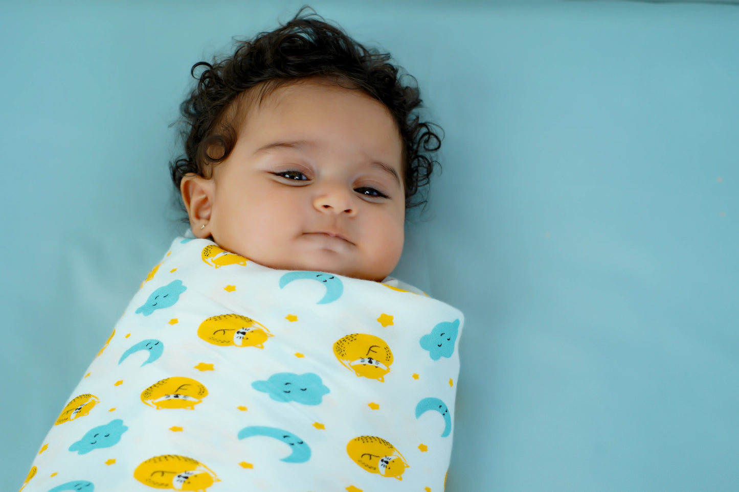 Cuddle up in Cat And Moon Print Bamboo Swaddle