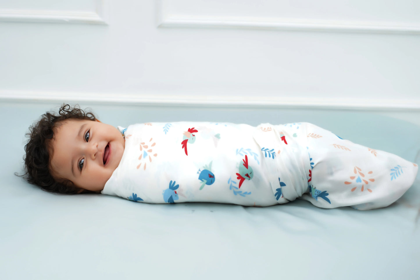 Cuddle up in Chirpy Bird Print Bamboo Swaddle