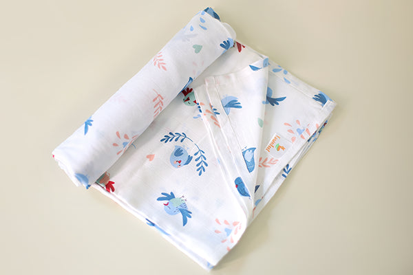 Cuddle up in Chirpy Bird Print Bamboo Swaddle