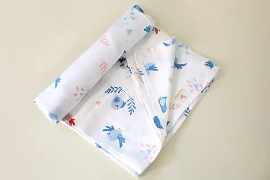 Cuddle up in Chirpy Bird Print Bamboo Swaddle